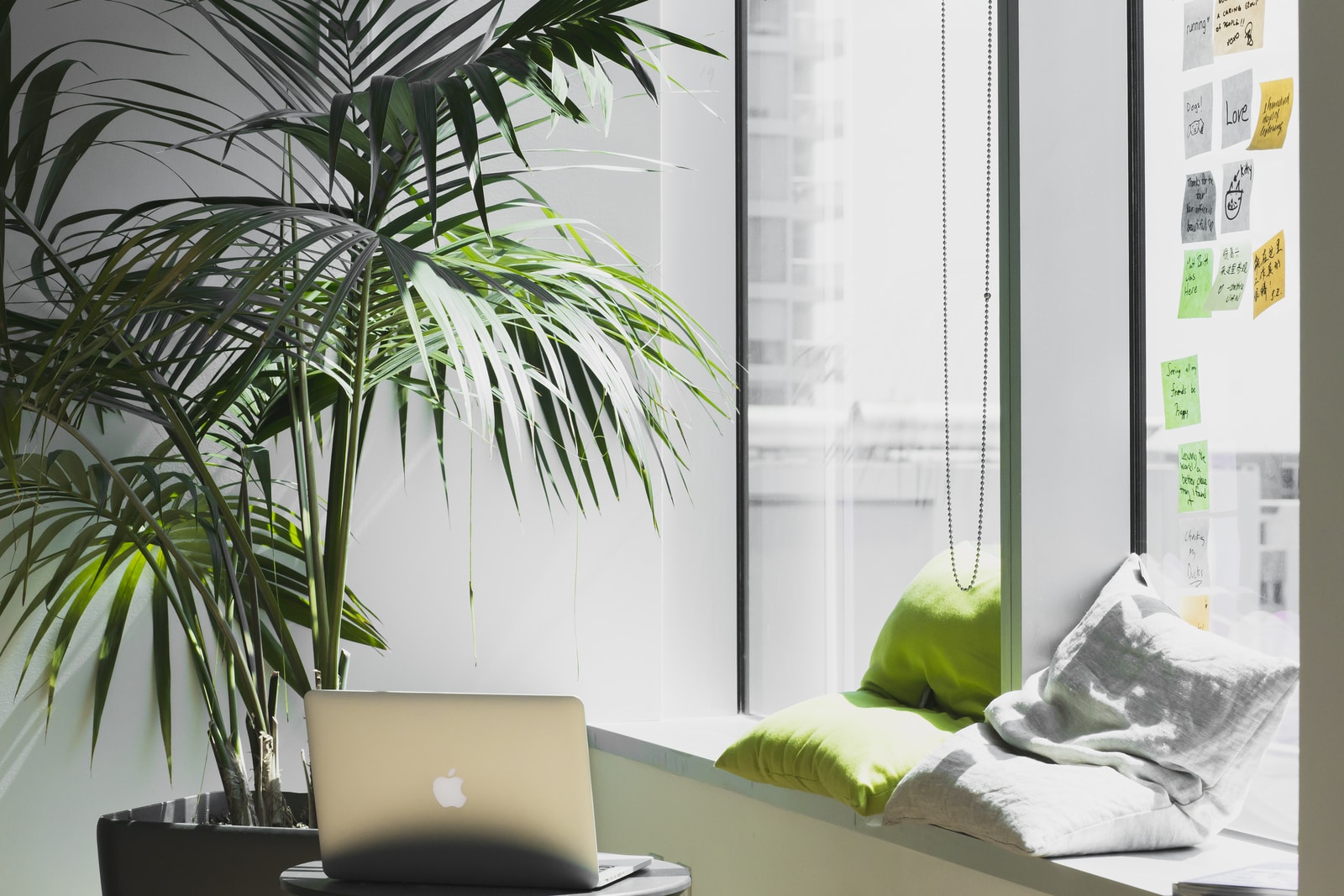 silver MacBook on top of table